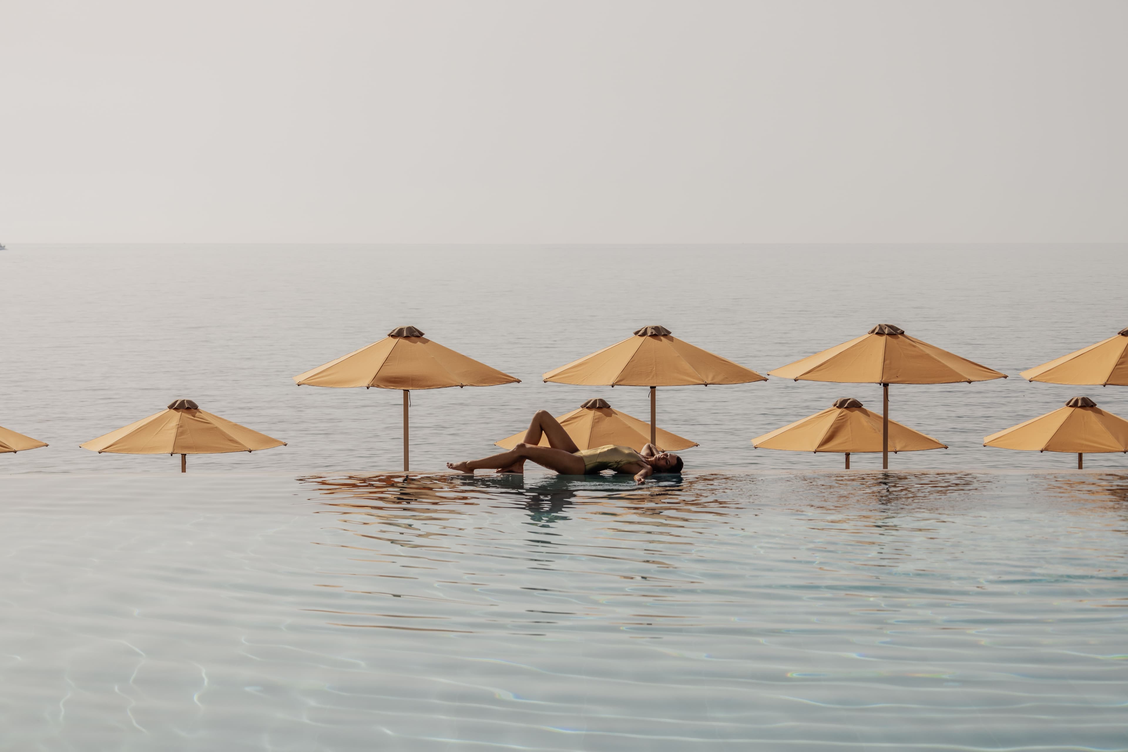 Cabo Hotel, Corfu — aerial view of resort with infinity pool & sea backdrop”