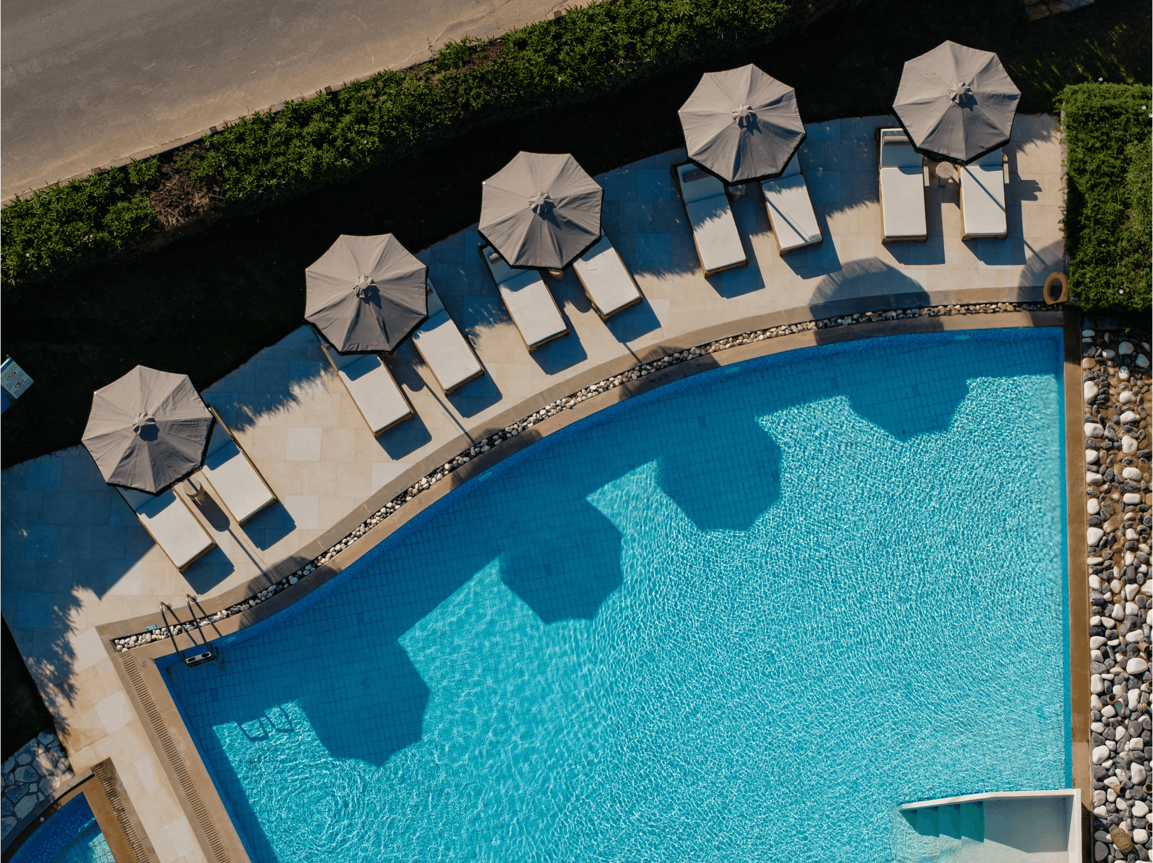 Restia Hotel Corfu exterior view with elegant architecture and lush gardens