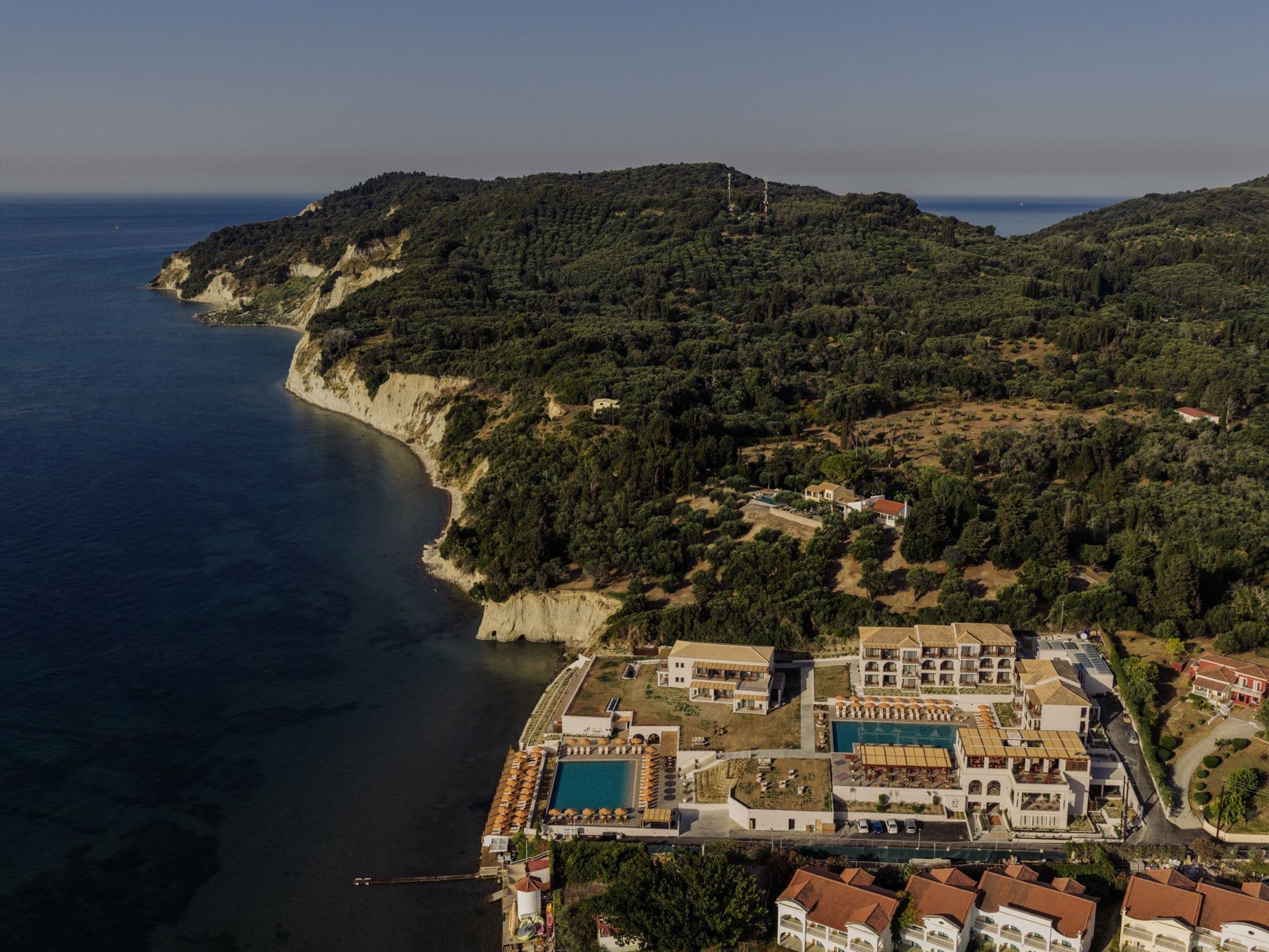 Aerial view of Corfu’s shore with one of Mayor Hotels gracing the landscape, your ideal haven for Corfu Greece holidays for 2026.
