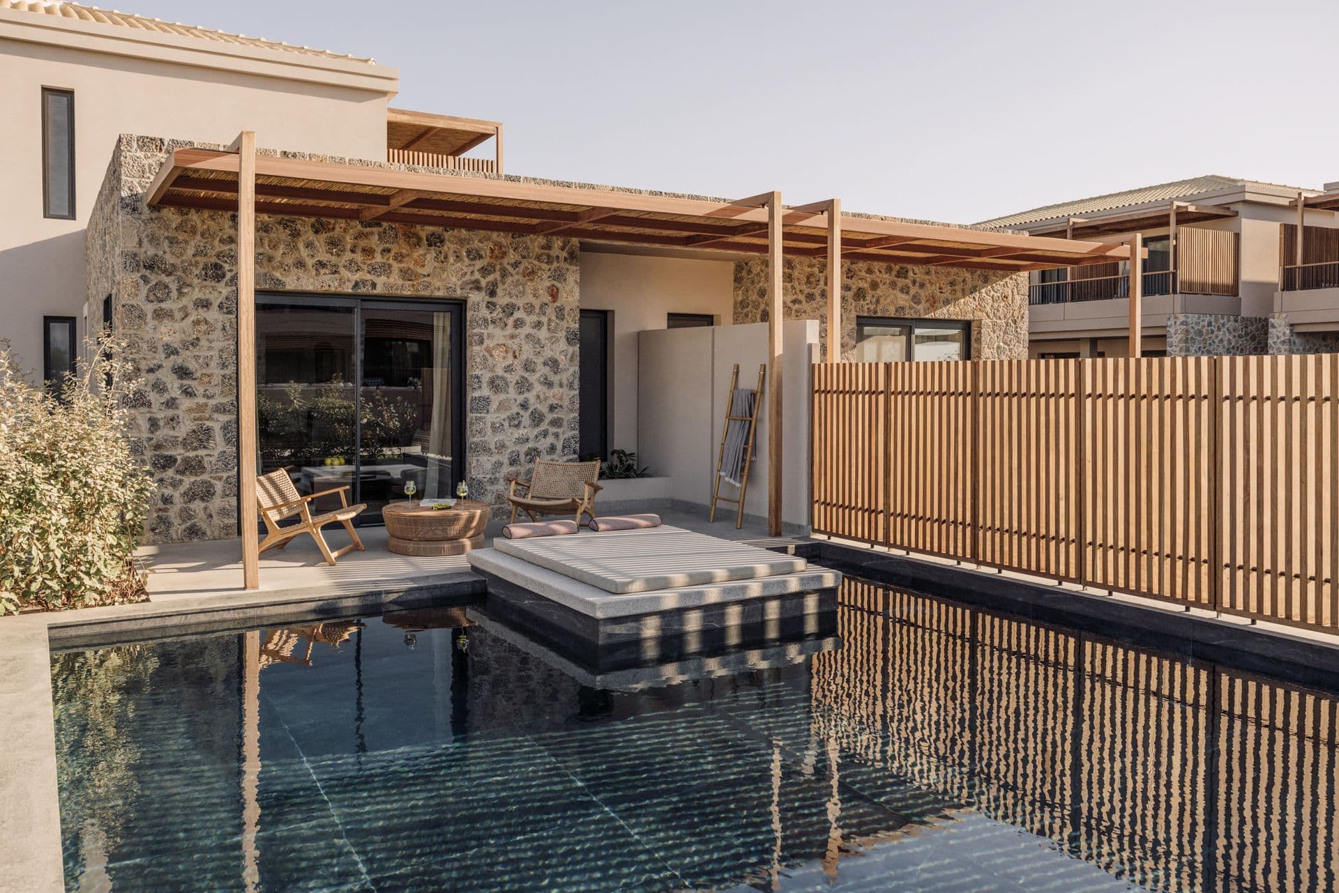 Junior Suite Private Pool at Unda Hotel in Corfu with secluded pool, private terrace, sun loungers, and elegant indoor-outdoor living