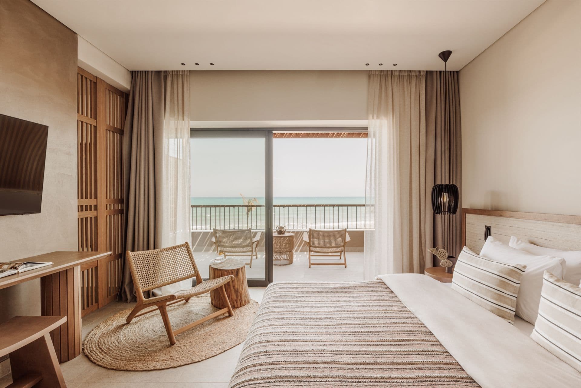 Junior Suite at Unda Hotel in Corfu with private balcony, scenic views, spacious interiors, and elegant contemporary design